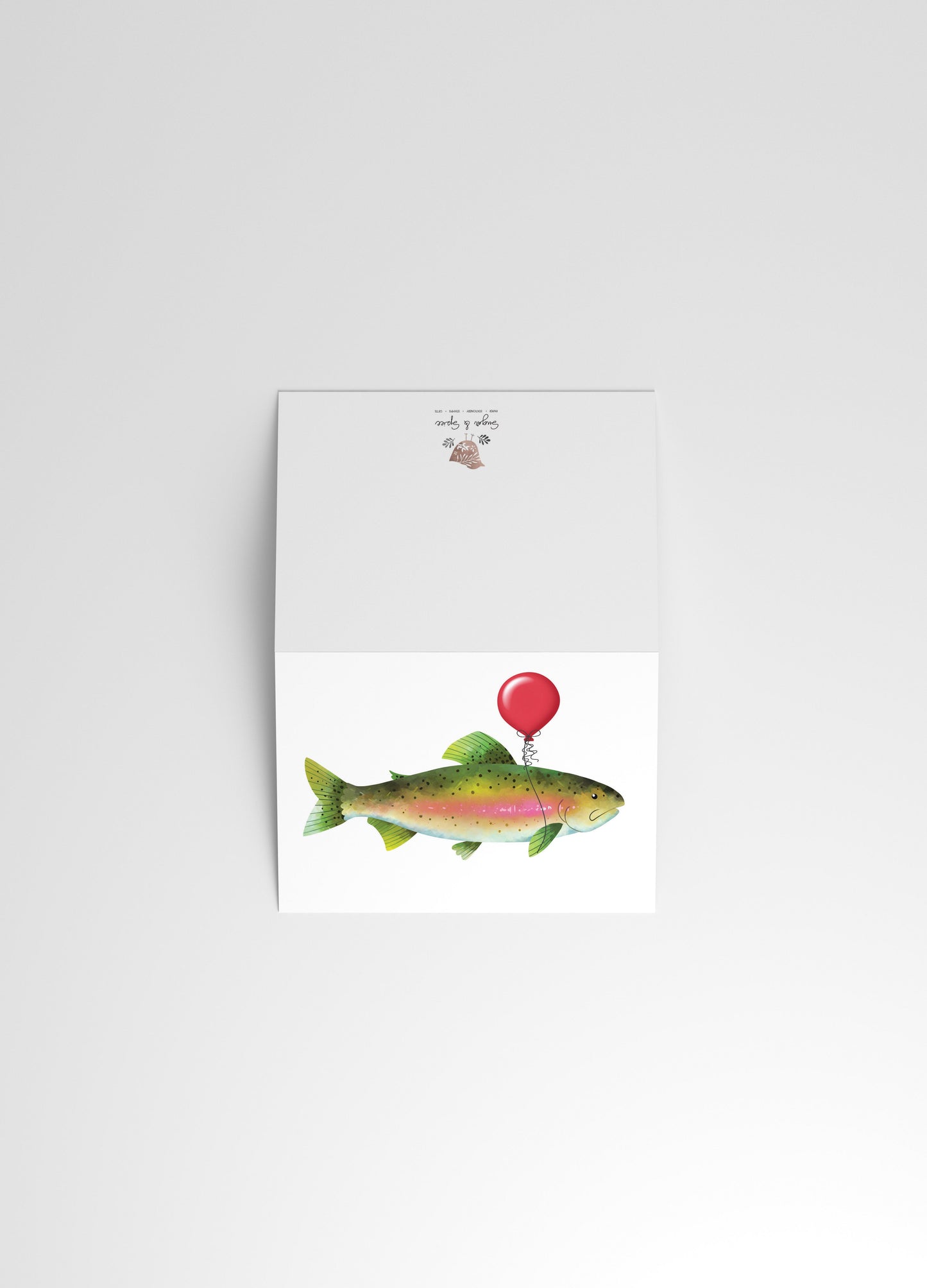 Notebook with a fish illustration on a white background