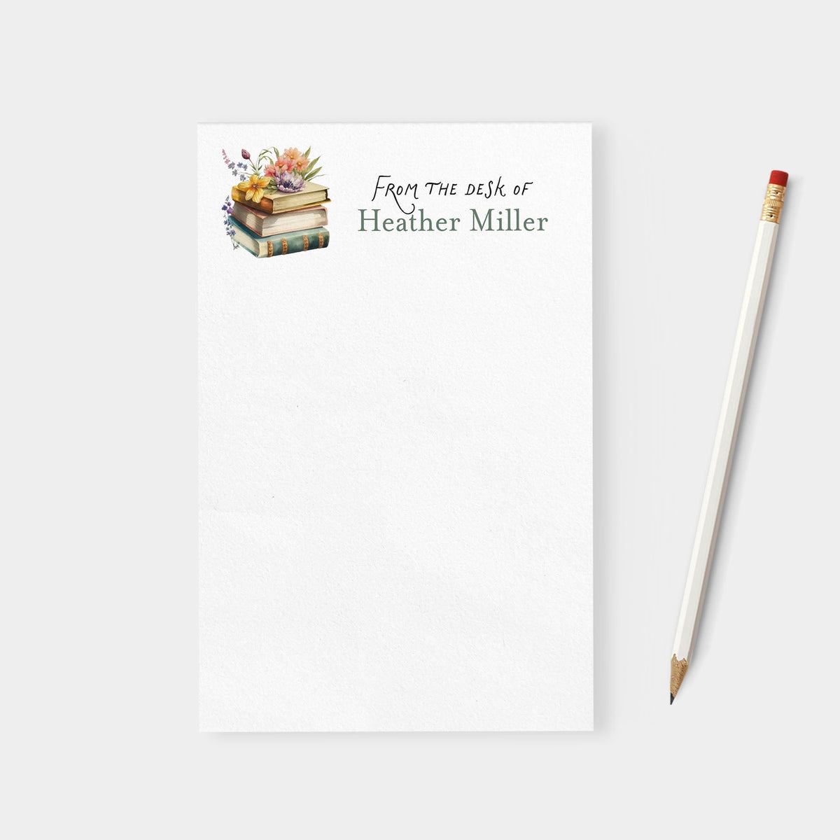 Notebook with 'From the desk of Heather Miller' text and a pencil on a white background