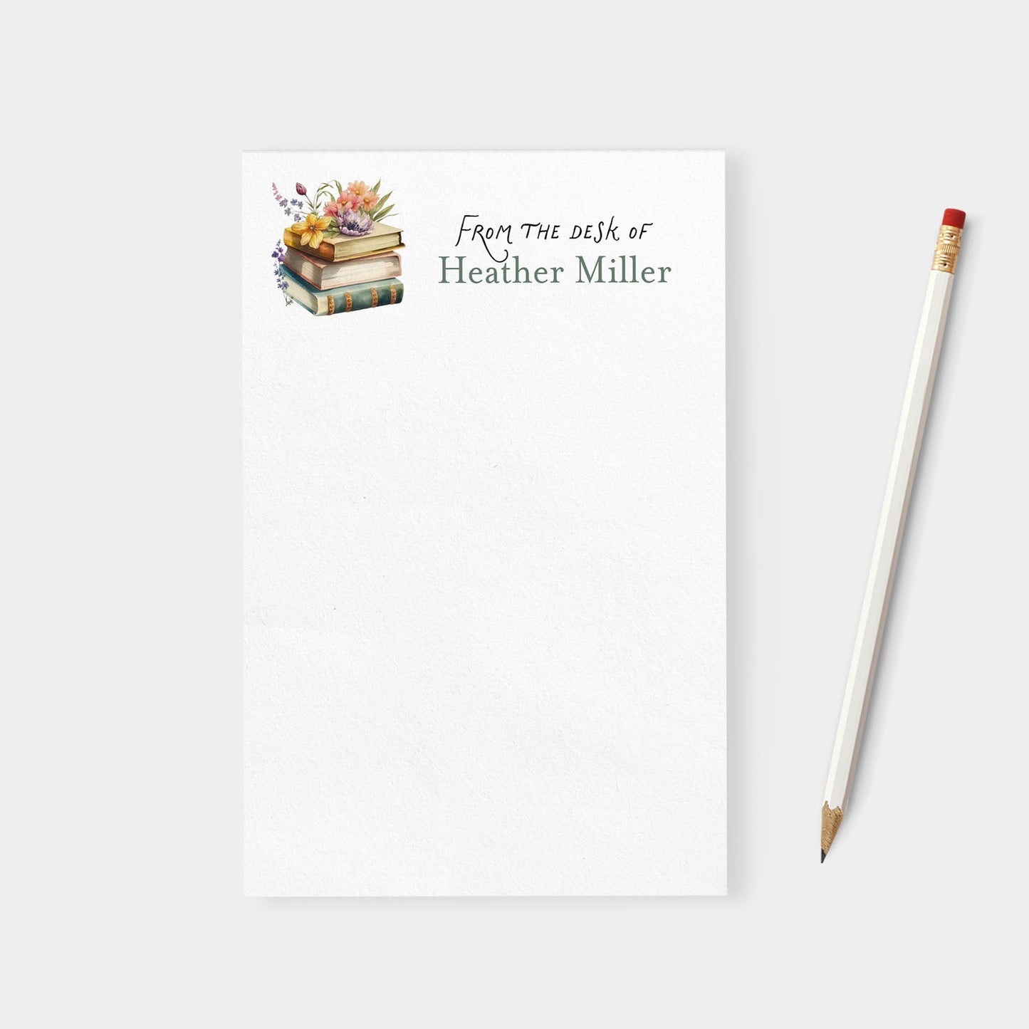 Notebook with 'From the desk of Heather Miller' text and a pencil on a white background