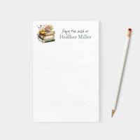Notebook with 'From the desk of Heather Miller' text and a pencil on a white background