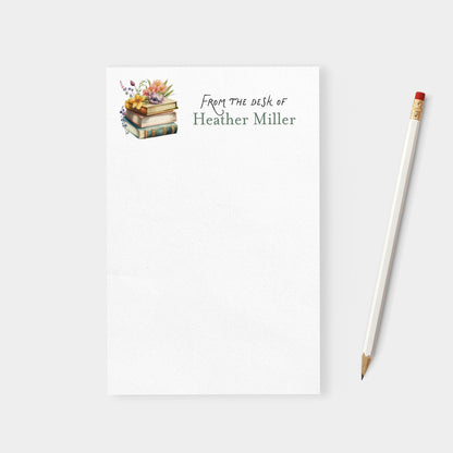 Notebook with 'From the desk of Heather Miller' text and a pencil on a white background