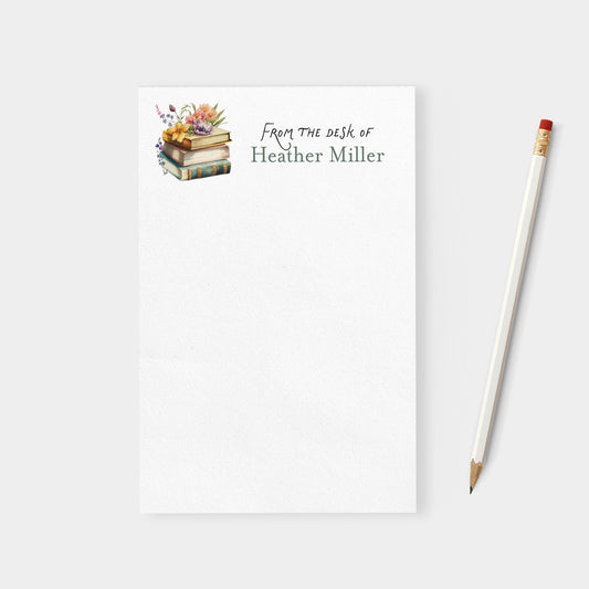 Notebook with 'From the desk of Heather Miller' text and a pencil on a white background