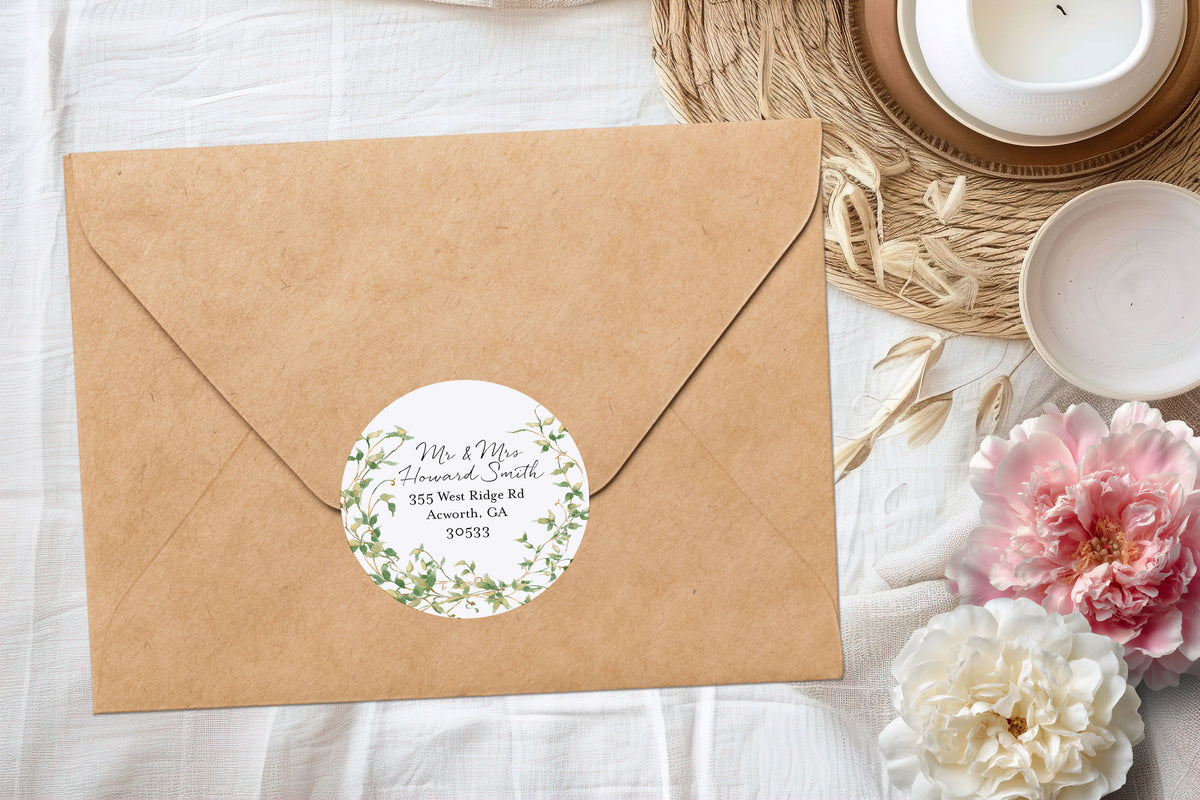 A kraft paper envelope with a round floral label featuring the text 'Mr. & Mrs.